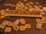 Feminism spelled in Scrabble letters
